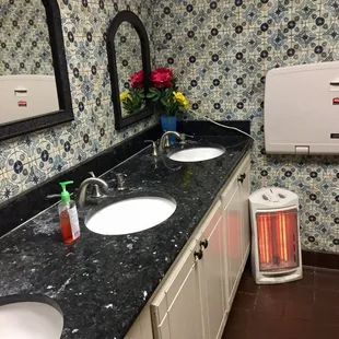 Women's bathroom. A little sketchy with the old school heater right by the sink?