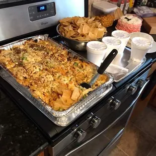 Yummy nachos and chips and salsa.