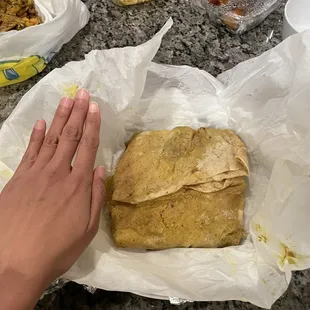 Dhalpouri wrap with potatoes and chickpeas