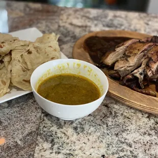 a plate of food and a bowl of soup