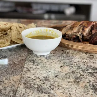 a bowl of soup and a plate of food