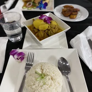 a plate of rice and a bowl of food