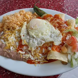 CHEESE ENCHILADAS TOOPED WITH AN EGG.