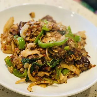 a plate of stir fried vegetables