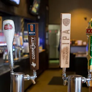 a row of beer taps