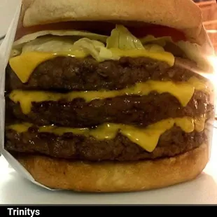a picture of a large cheeseburger