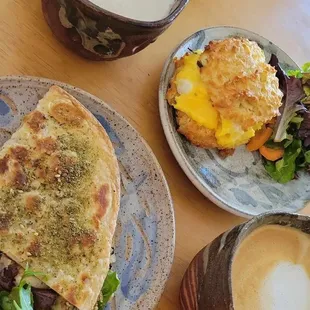 a plate of food and a cup of coffee
