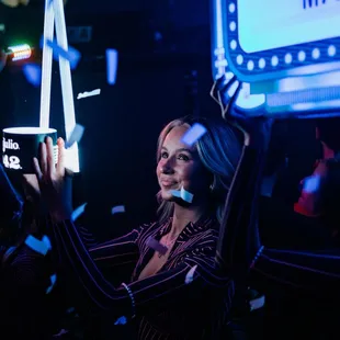 a woman holding up a cell phone