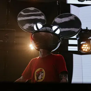 a man wearing a mickey mouse hat