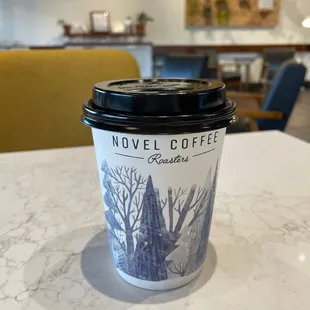 a cup of coffee on a table