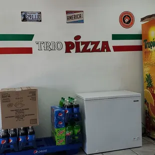 a man standing in front of a refrigerator