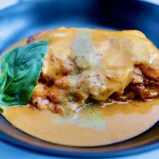 Seafood Lasagna
Baked layers of pasta filled with shrimp, crab, and lobster.  Then topped with pesto cream and lobster bisque