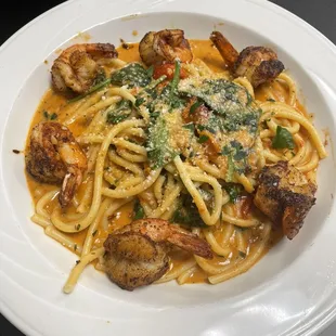 a plate of pasta and meat