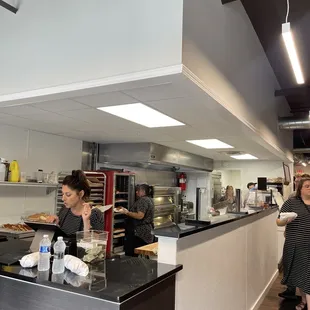 a woman serving food in a restaurant