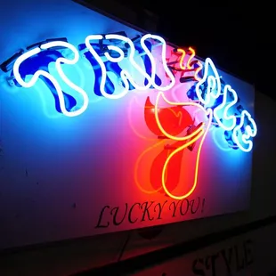 a neon sign for a restaurant