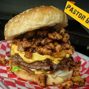 a large burger with meat and cheese