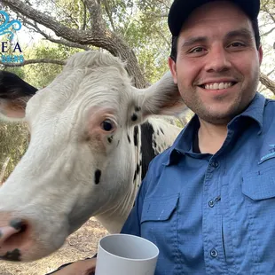 Billy the cow posing with Eric.