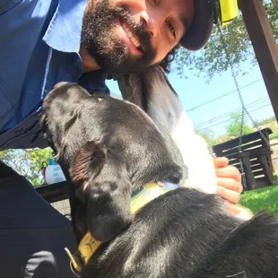 A friendly puppy giving Mike B some love!