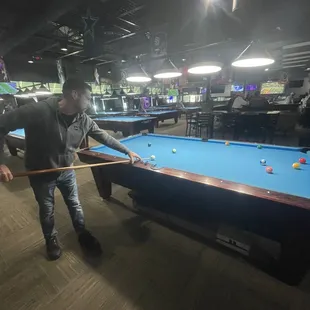 a man playing pool