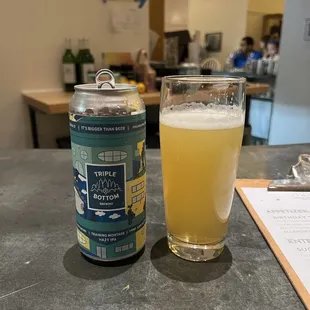 a can and a glass of beer