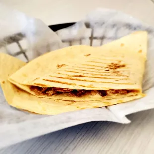 a quesadilla in a basket