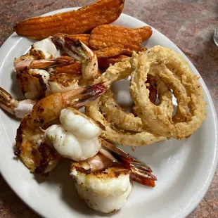 Shrimp - Mesquite grilled w/ sweet potato fries and onion rings. This place is awesome. Will be back for sure.