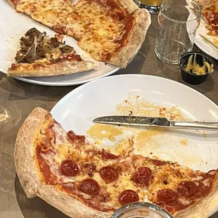Wild mushrooms with sausage, cheese, and pepperoni pizzas.