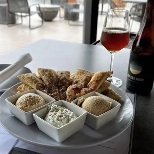 a plate of food and a glass of wine