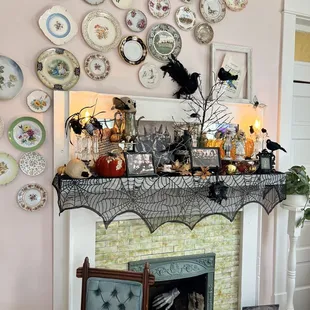 a fireplace mantle decorated for halloween