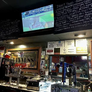 View of beer menu and TV&apos;s at the bar