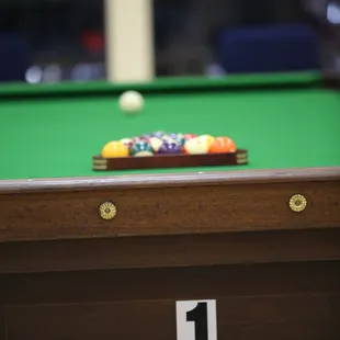 a pool table with a ball on it