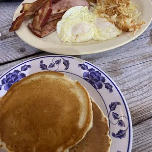 The boss plate. Eggs hash browns bacon ham with pancakes