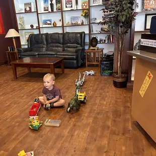 a toddler playing with toys