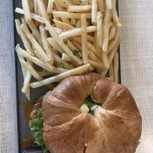 BBQ shrimp sandwich on croissant bun