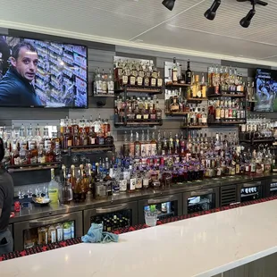 a bar with a large screen tv