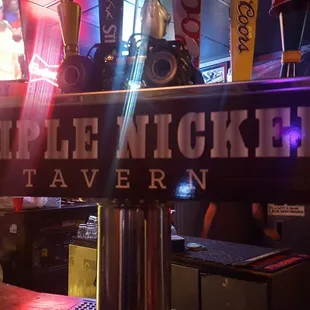 a bar with neon signs