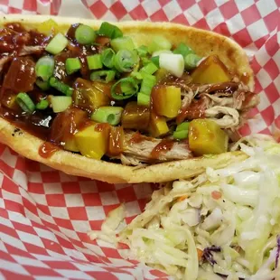 a pulled pork sandwich and coleslaw