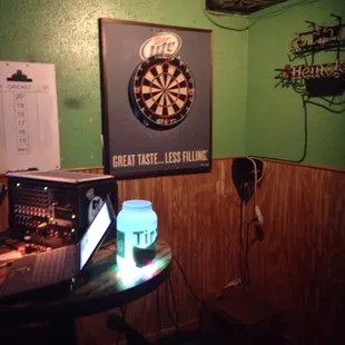 Darts area doubles as the kareoke stage.