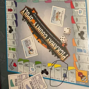 a board game with dice and cards