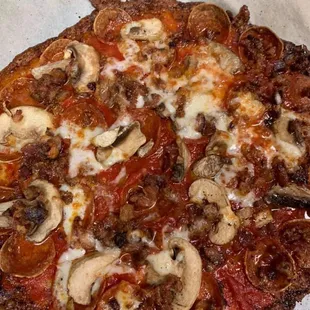 a pizza with mushrooms and cheese
