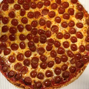Delicious Pizza! Thin crispy crust, old home town recipe!  Small cupping pepperoni. Dough made fresh daily. Flour, eggs, milk, yeast. Enjoy!