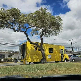 Look for the Yellow truck parked at Waipahu District Park (near tennis/basketball courts)
