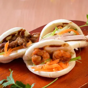 two baoboa buns with meat and vegetables