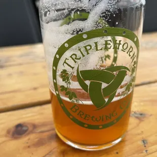 a pint of beer on a table