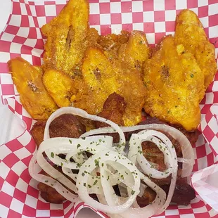 Carne Frita with tostones on garlic sauce.