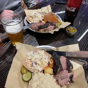 Brisket plate with smoked Gouda mac, coleslaw, beans, homemade pickles and jalapeños.
