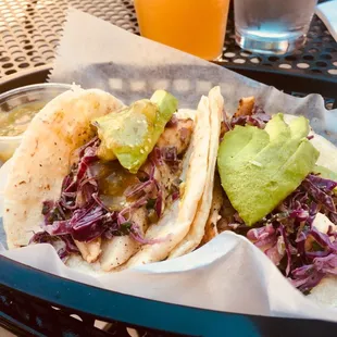 Fish tacos with sliced avocado