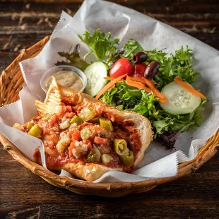 a basket of food on a wooden table