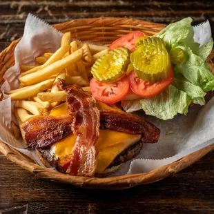 a basket of food including a burger and fries