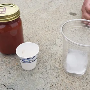 Bloody Mary. Ice cube and cups provided.